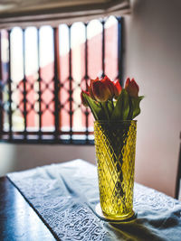 Close-up of rose on table at home