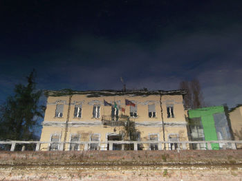 Built structure against sky at night