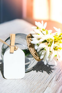 Close-up of white flower vase on table