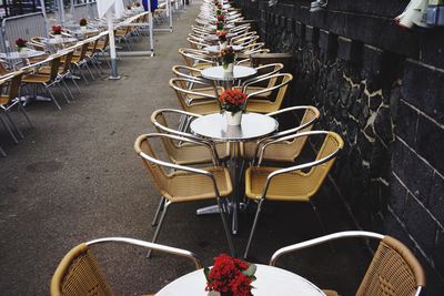 High angle view of chairs and table arranged on street