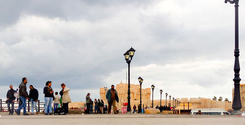 People in city against sky