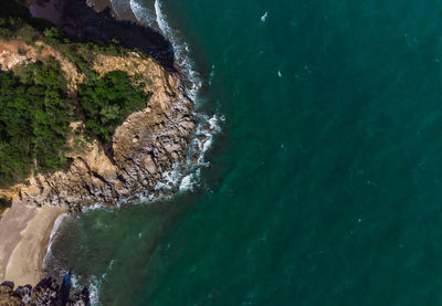 High angle view of rocks on sea