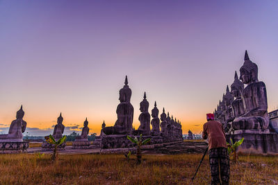 View of traditional building against sky during sunset