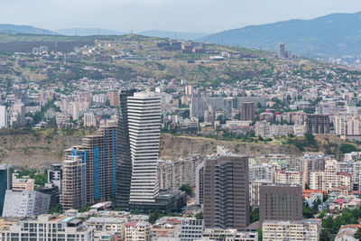 High angle view of buildings in city against sky