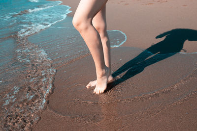 Low section of person on beach