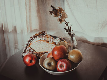 Close-up of apple on table at home