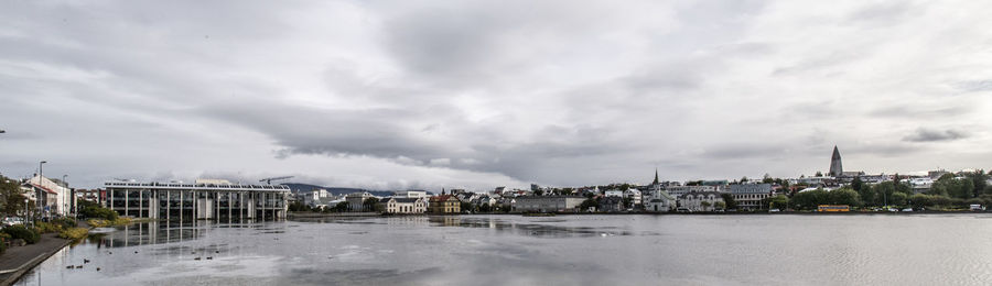 View of city against cloudy sky