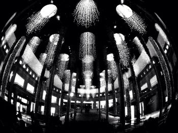 Low angle view of illuminated lights at night