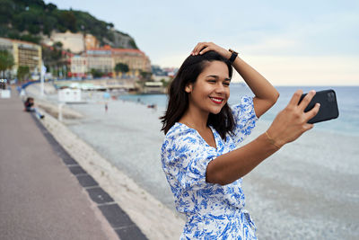 Young woman using mobile phone