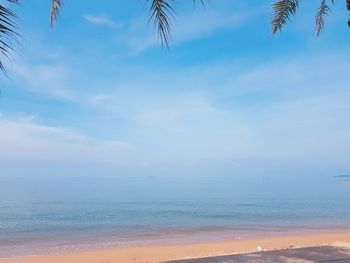 Scenic view of sea against blue sky