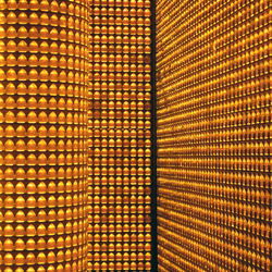 Full frame shot of lit candles in niches at temple