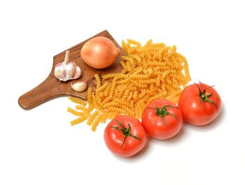 Close-up of tomatoes against white background