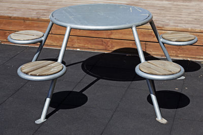 High angle view of empty chair on table