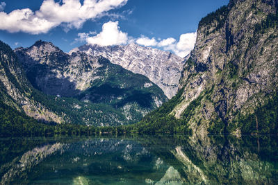 Scenic view of lake and mountains against sky