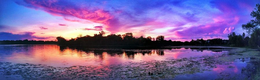 Scenic view of lake at sunset