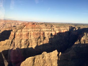 Scenic view of rocky mountains against sky