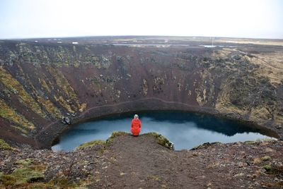 Rear view of person on volcanic mountain