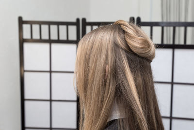 Close-up of woman with blond hair in salon