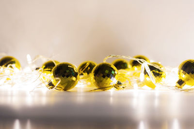 Close-up of yellow glass on table