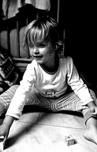 Girl sitting on floor