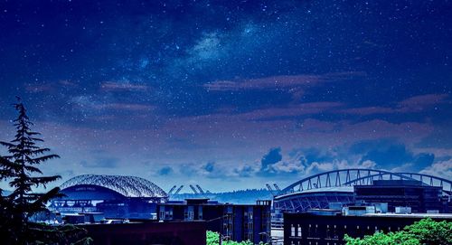 Arch bridge against sky at night