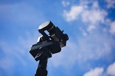 Low angle view of camera against sky