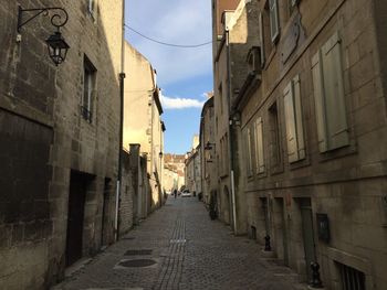 Narrow alley amidst buildings in town