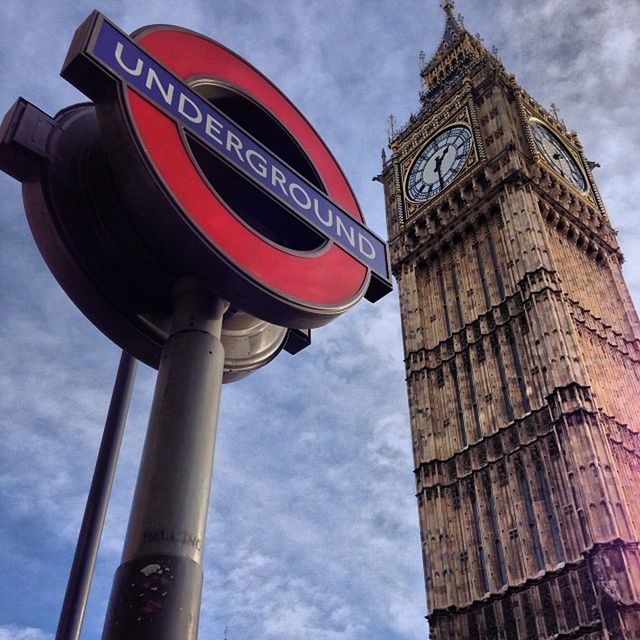 architecture, low angle view, built structure, building exterior, tower, tall - high, city, sky, clock tower, travel destinations, famous place, capital cities, international landmark, travel, tourism, skyscraper, big ben, communication, cloud - sky, tall