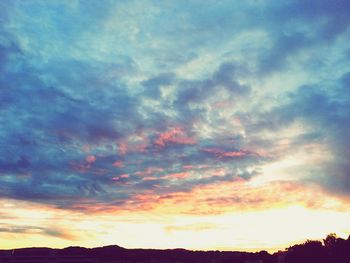 Low angle view of dramatic sky during sunset