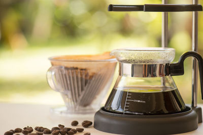 Close-up of coffee maker on table