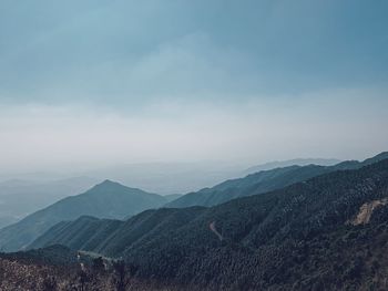 High angle view of mountain range against cloudy sky