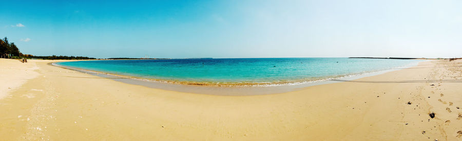 Scenic view of beach against clear sky