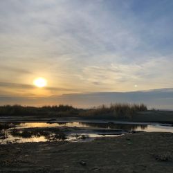 Scenic view of lake against sky during sunset