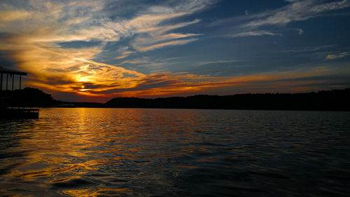 Scenic view of lake of the ozarks against sky during sunset