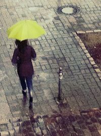 Woman standing on footpath