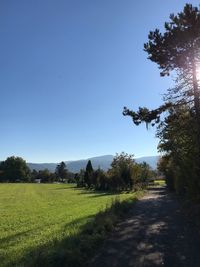 Scenic view of land against clear blue sky