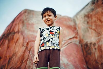 Portrait of boy standing outdoors