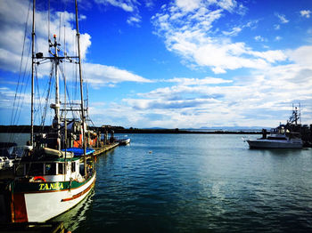 Boats moored at harbor