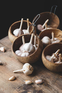 Close-up of garlic bulbs on table