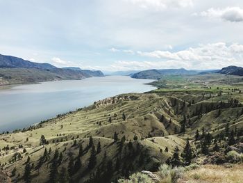 Scenic view of landscape and mountains against sky