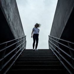 Low angle view of people walking on stairs