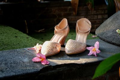 Close-up of elegant shoes on rock