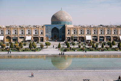 Group of people in front of buildings