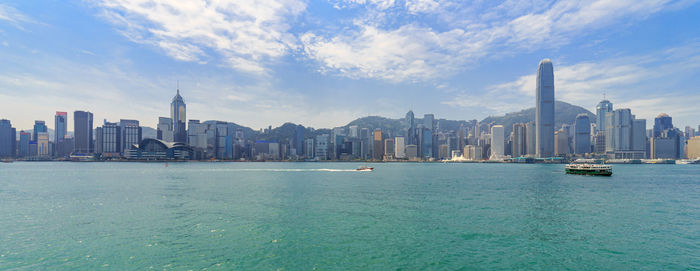 Sea with buildings in background