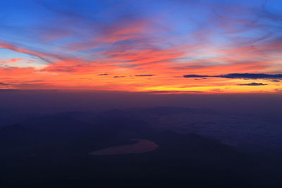 Scenic view of dramatic sky at sunset