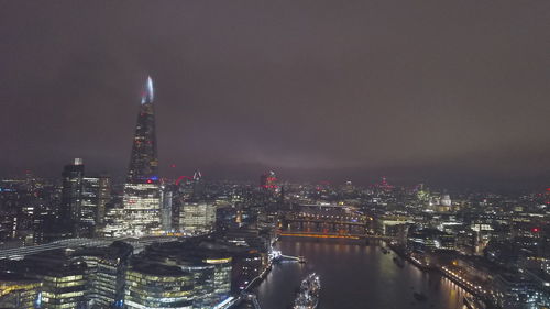 Illuminated buildings in city at night