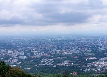 High angle view of city buildings against sky