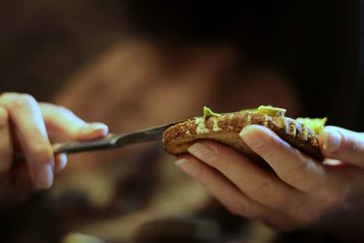 Close-up of hand holding bread