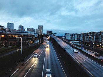 High angle view of illuminated city against sky