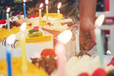 Close-up of hand holding cake